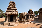 Mamallapuram - Tamil Nadu. The five Rathas. The Nakula Sahdeva Ratha with elephant carved  from a single stone stands next to it. 